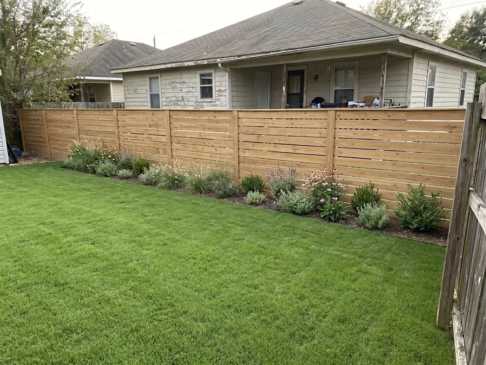 A backyard landscape design generated by OutdoorBrite from the owner's photo