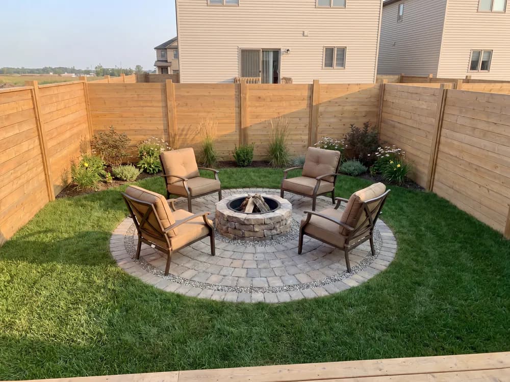 A backyard landscape design generated by OutdoorBrite from the owner's photo
