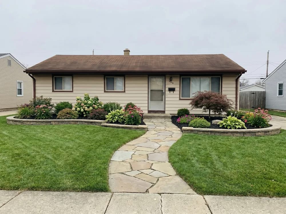 A backyard landscape design generated by OutdoorBrite from the owner's photo