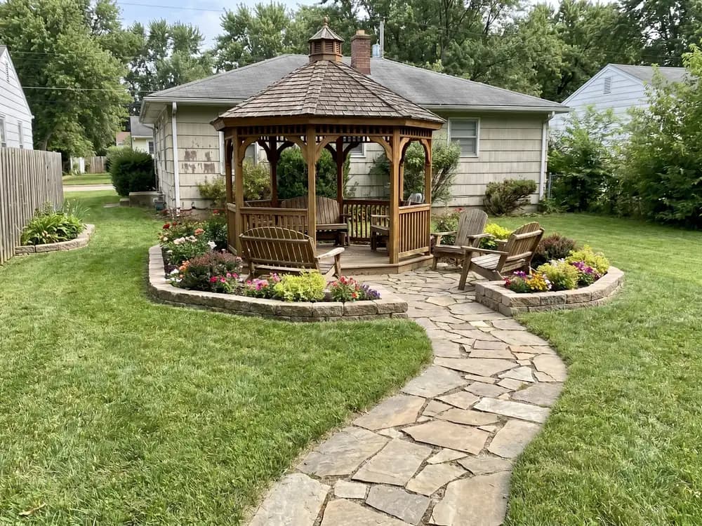 A backyard landscape design generated by OutdoorBrite from the owner's photo