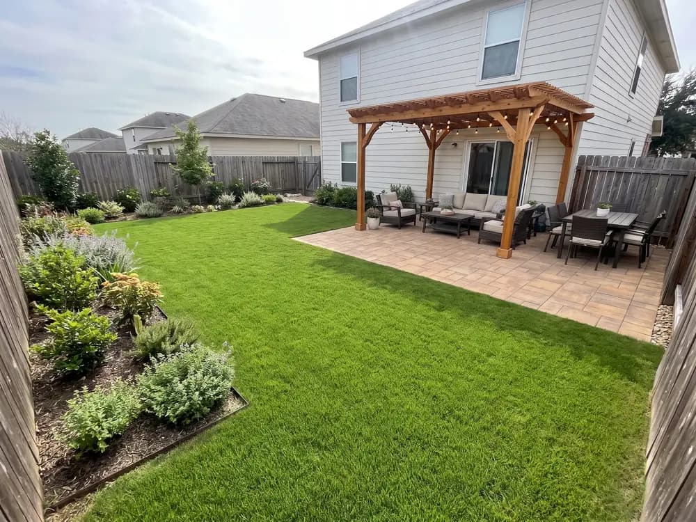 A backyard landscape design generated by OutdoorBrite from the owner's photo