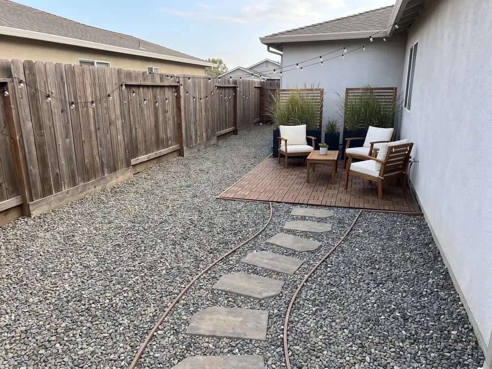 A backyard landscape design generated by OutdoorBrite from the owner's photo