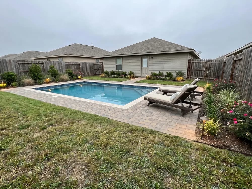 A backyard landscape design generated by OutdoorBrite from the owner's photo