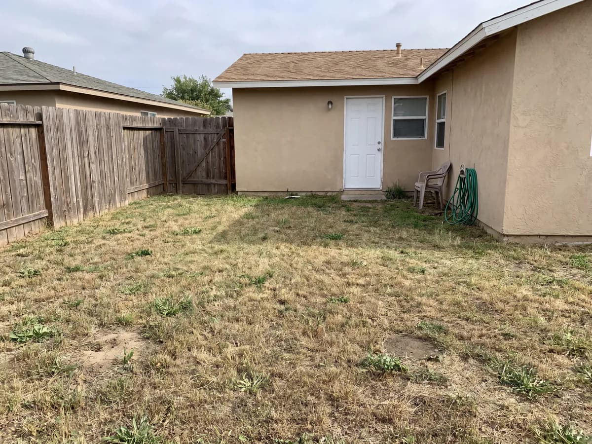 AI xeriscape design before and after: a thirsty lawn photo redesigned into a low-water, drought-friendly yard.