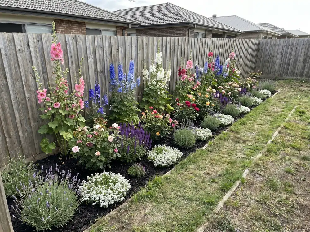 A backyard landscape design generated by OutdoorBrite from the owner's photo