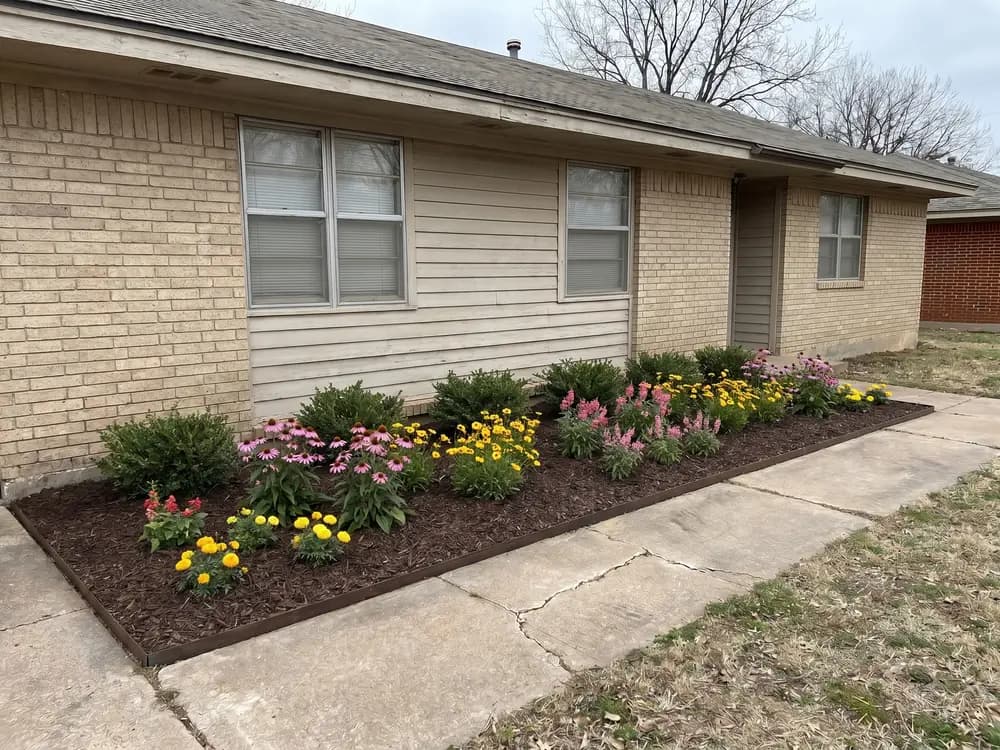 A backyard landscape design generated by OutdoorBrite from the owner's photo