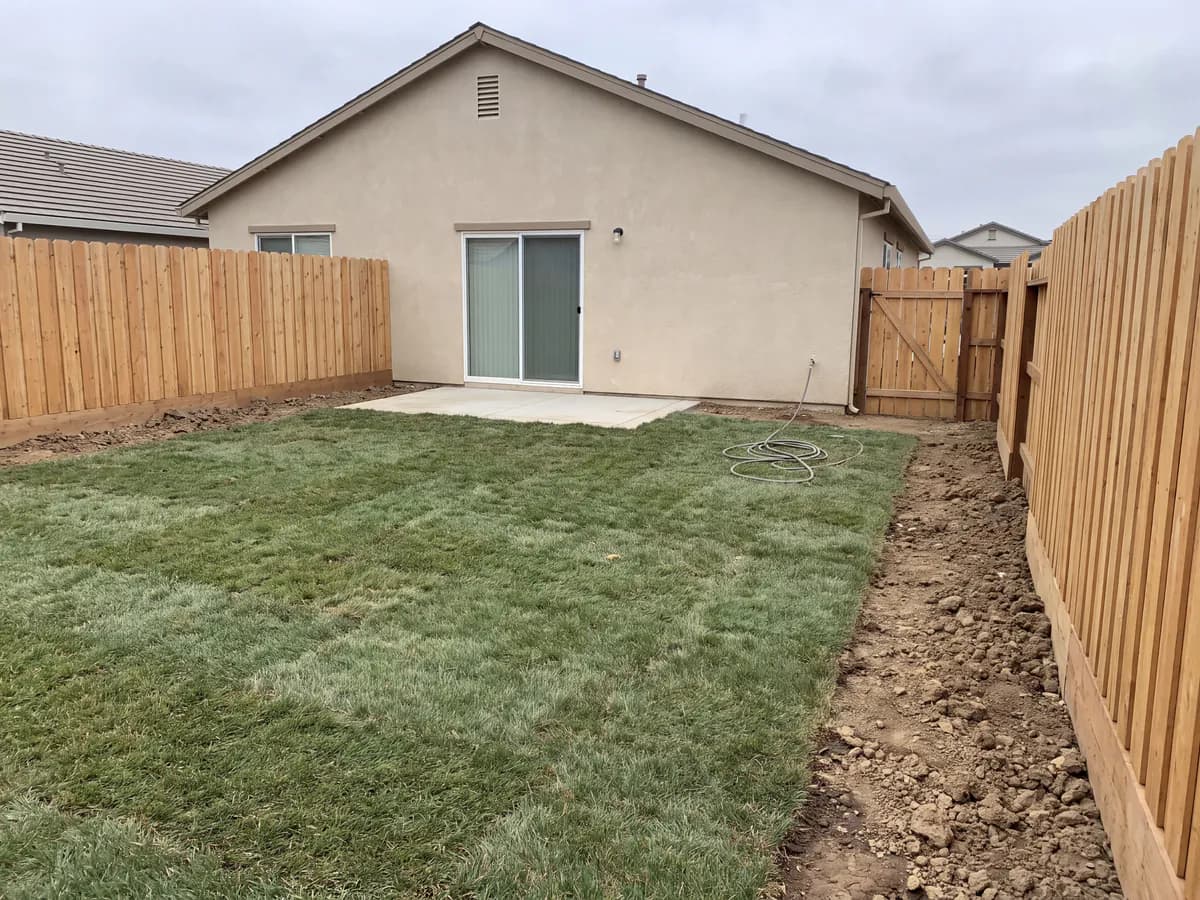 Garden landscaping app before and after: a real garden photo redesigned with new beds, planting and a stone path.