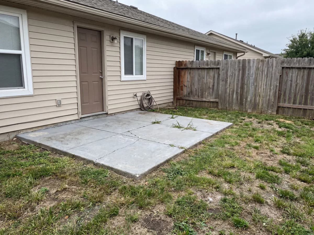 Outdoor kitchen design tool before and after: a bare patio photo turned into a built-in outdoor kitchen.