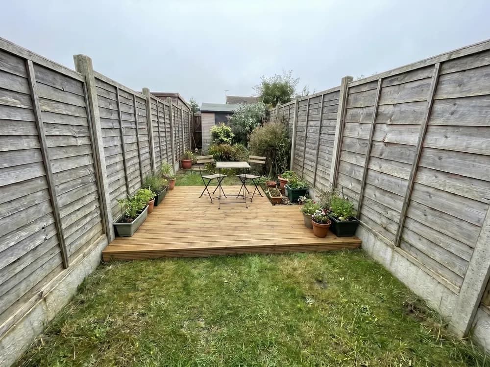 A backyard landscape design generated by OutdoorBrite from the owner's photo