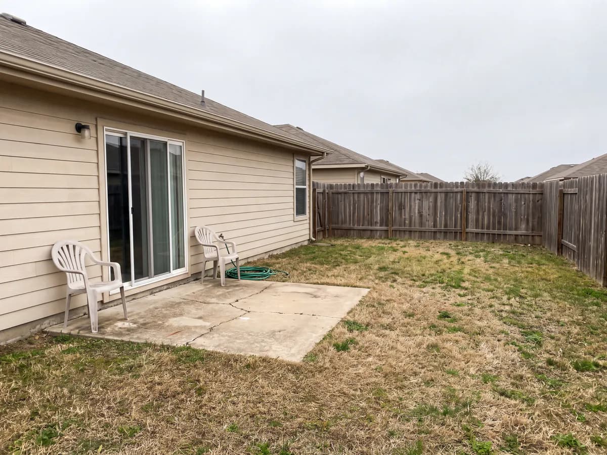 Patio design app before and after: a worn patio photo redesigned into a finished outdoor living area.