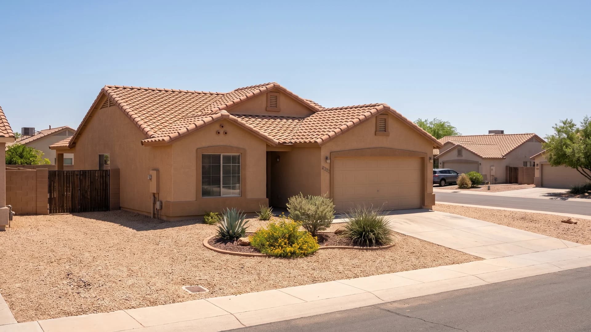 Warm tan gravel chosen to match the stucco and roof tile of a Southwest home